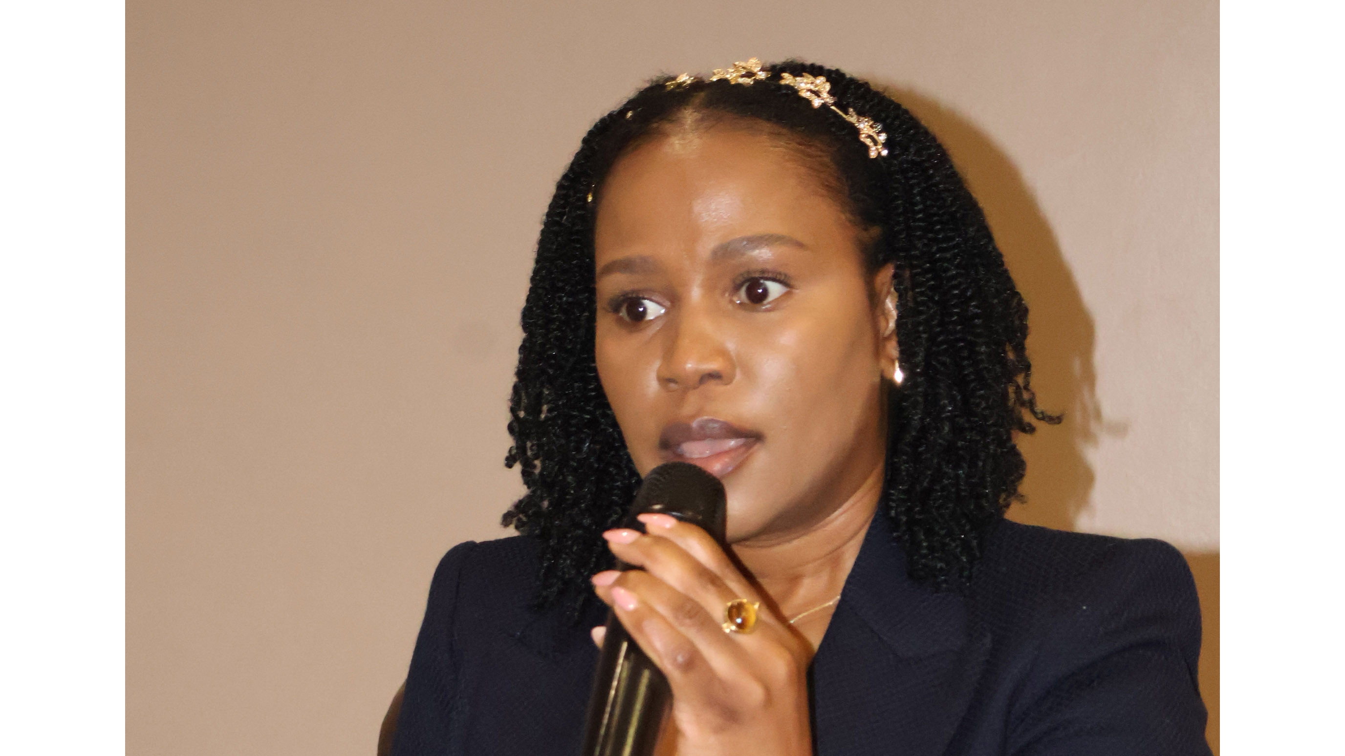 Embiveni Meat Industries MD Phindile Matsebula posing a question to the Minister for Agriculture, Mandla Tshawuka. 